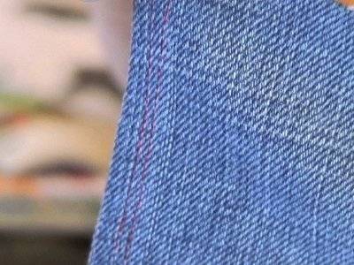 Blue denim material is spread out of the area.
