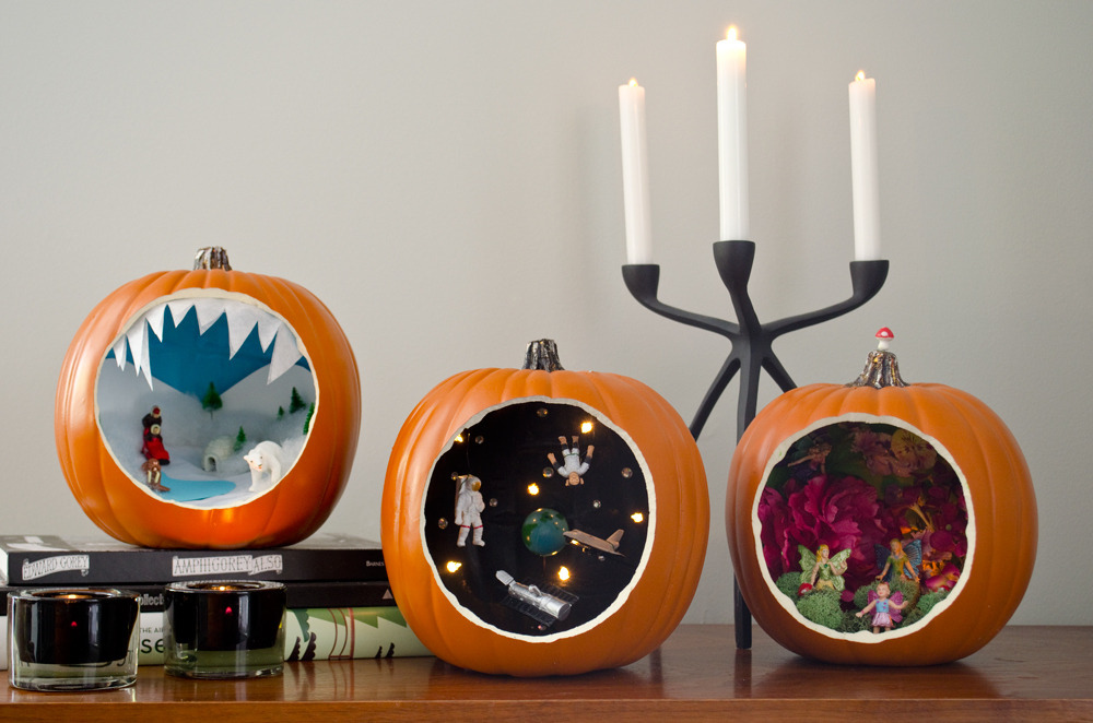 Unique carved pumpkins with dioramas inside them.