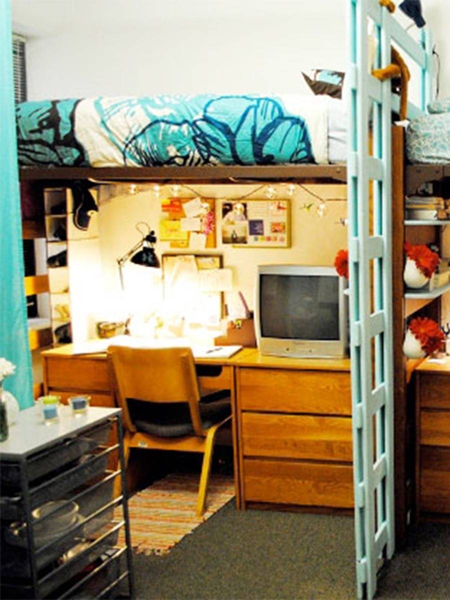 Room having a wooden table and chair with a television on top of it