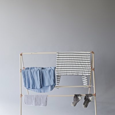 Perfect for small spaces - a collapsible wooden drying rack for laundry.