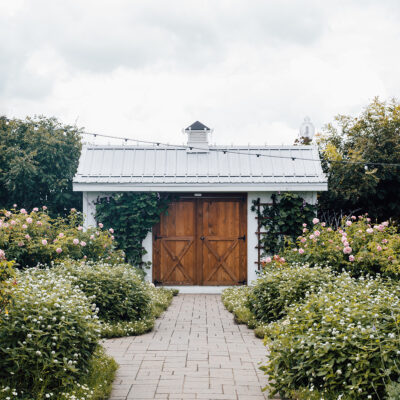 spring garden barn with flowering shrubs